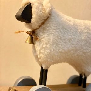 Hand made wooden sheep pull along toy with brass bell.